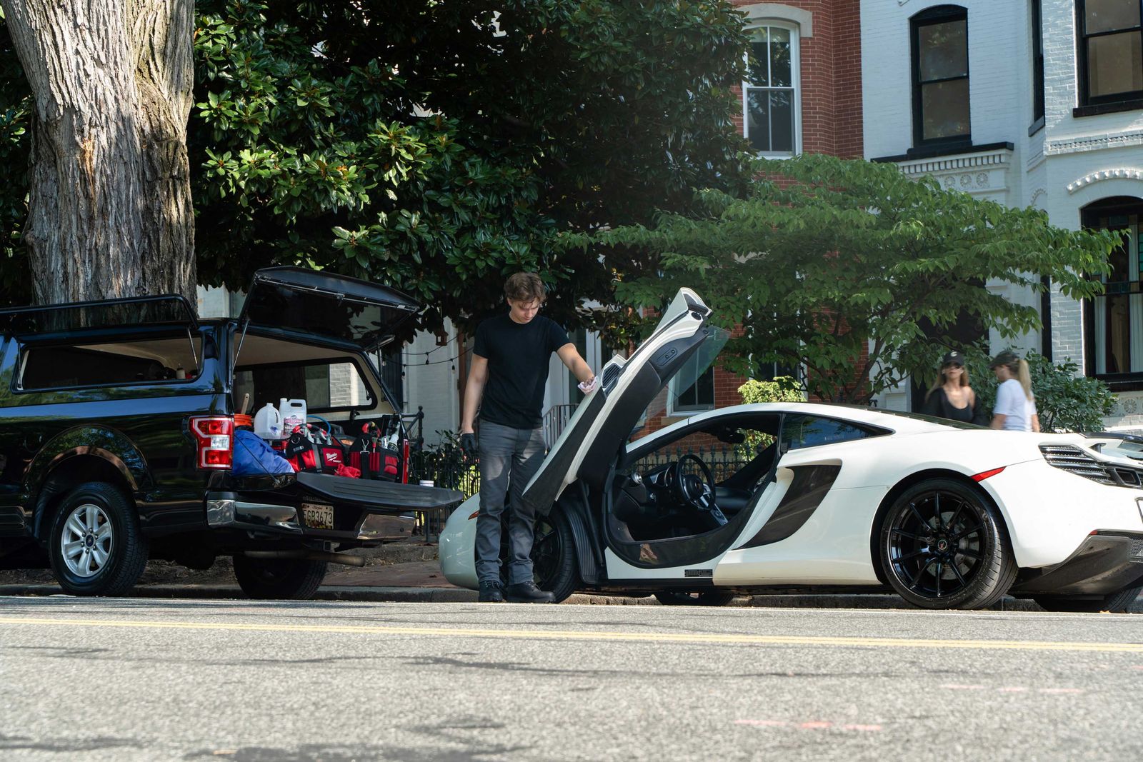 James detailing a McLaren on a residential street