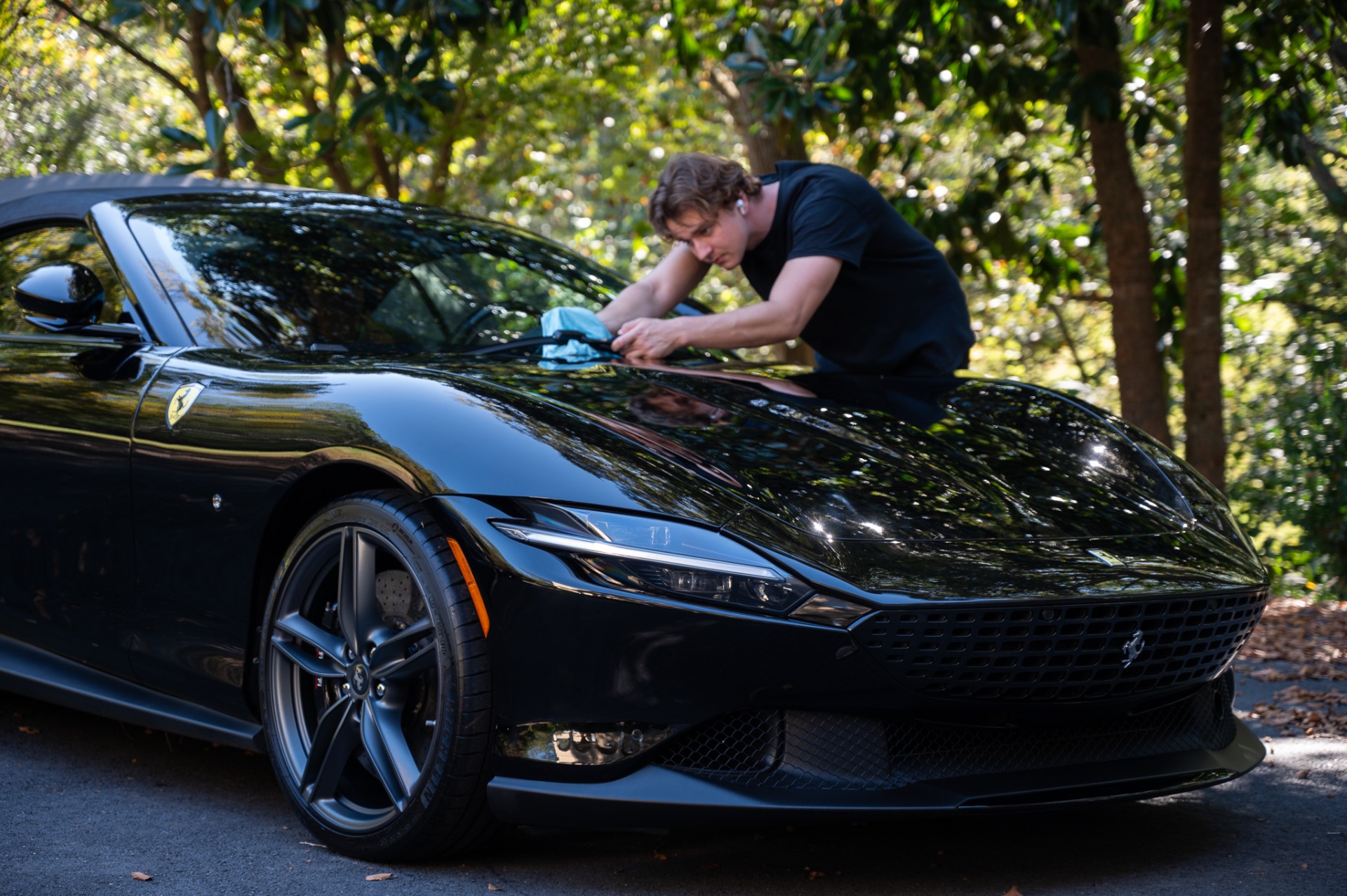 Black Ferrari with mirror-like ceramic coating finish